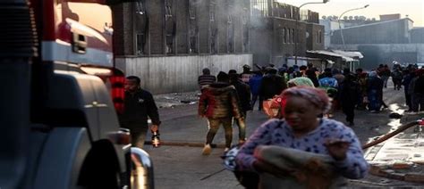 Emergency services says death toll jumps to 52 in a fire in a building in South Africa’s biggest city